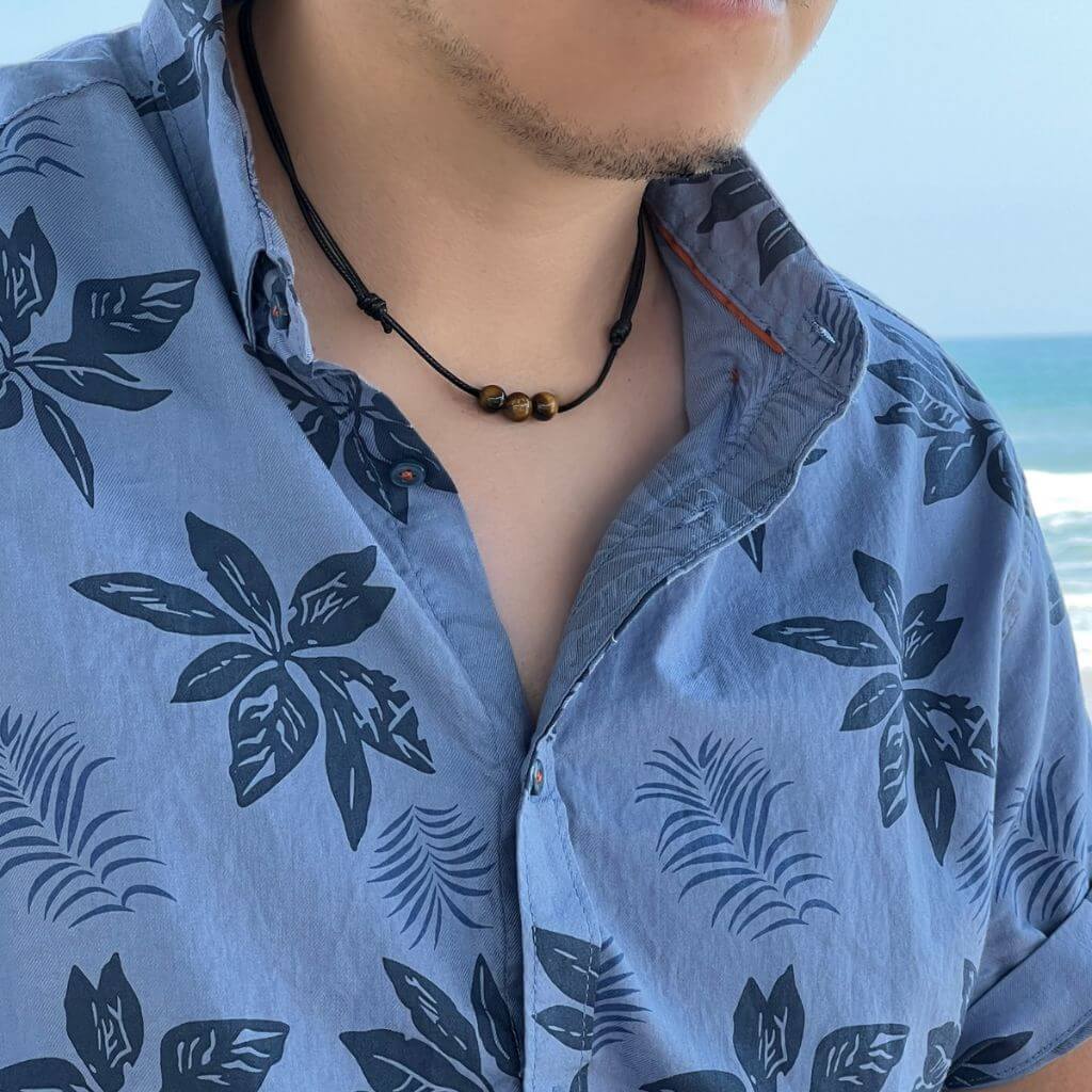 Men showcasing a Tiger Eye Choker, with the stone's distinctive golden-brown shimmer accentuating their stylish and confident look - Luck Strings