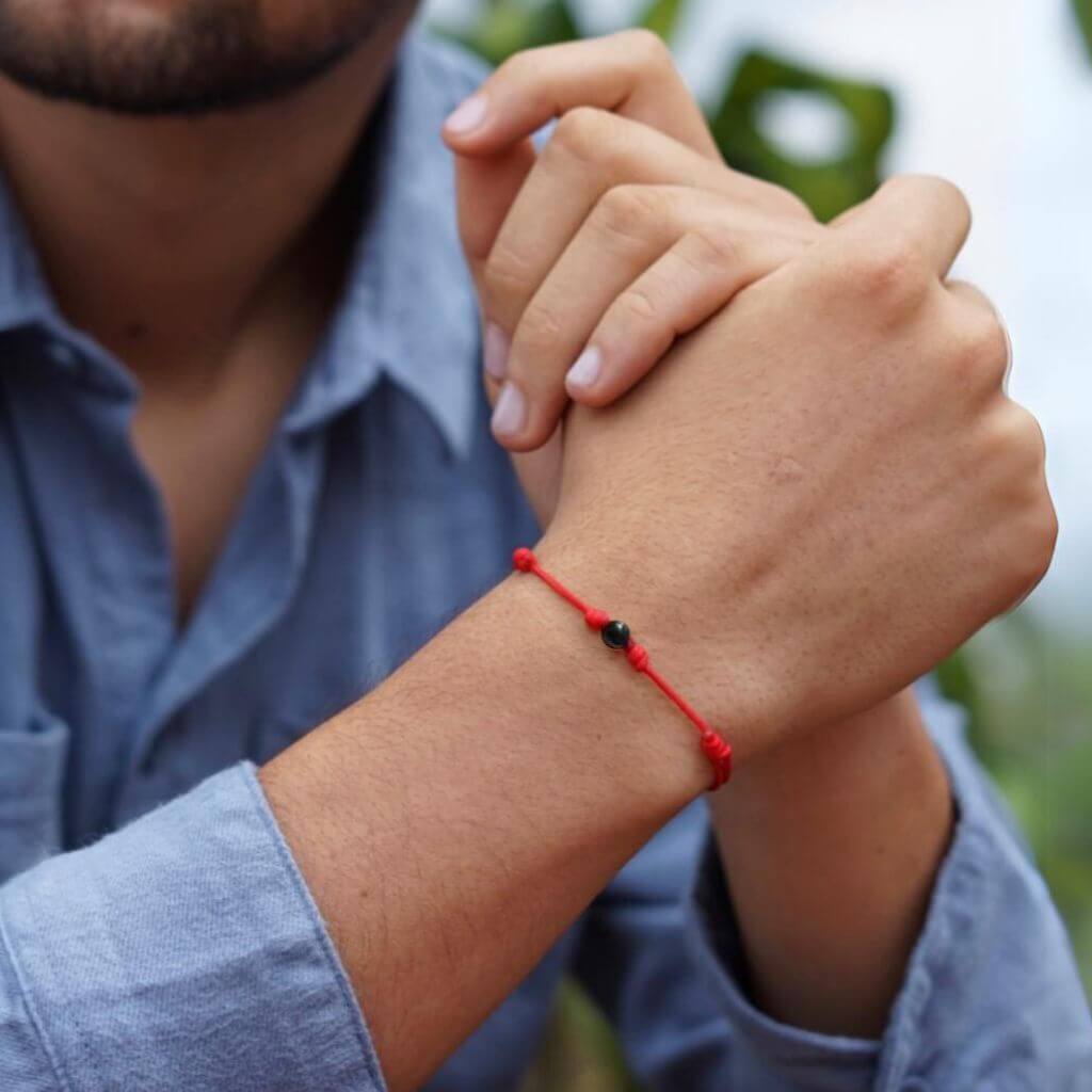Man wearing the Luck Strings Energy Shield Black Tourmaline Bracelet, combining strength with elegance.