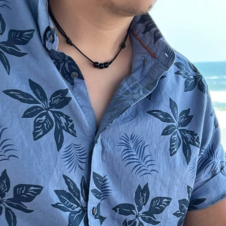 Man adorned with a Black Tourmaline Beaded Choker, highlighting how the dark, protective beads complement his modern and stylish look - Luck Strings