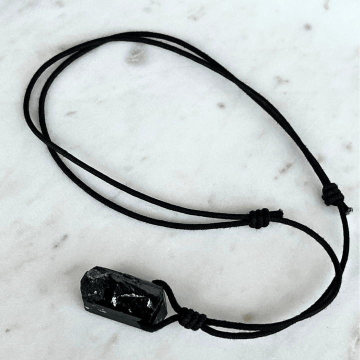 One-of-a-Kind Raw Black Tourmaline Pendant - A unique symbol of protection and individuality by Luck Strings.