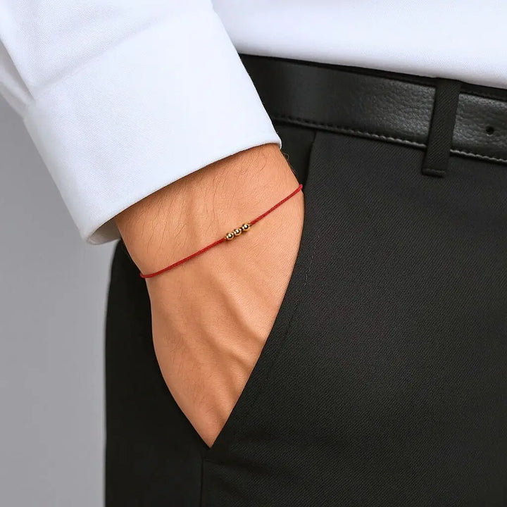 Man Wearing Solid Gold Red String Bracelet Handmade by Luck Strings