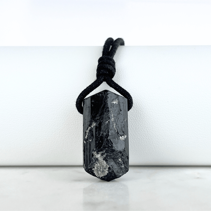 One-of-a-Kind Raw Black Tourmaline Pendant - A unique symbol of protection and individuality by Luck Strings.