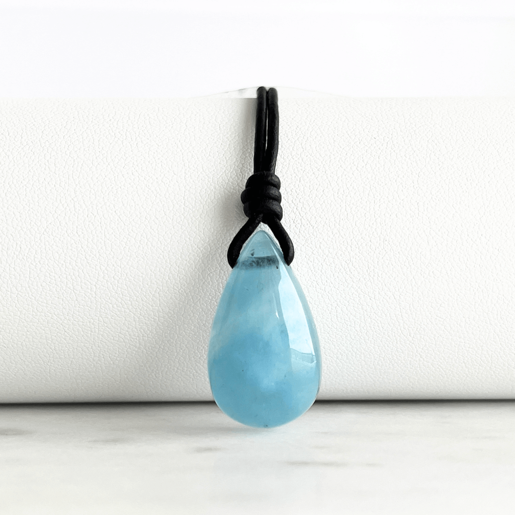 Serene Waters Aquamarine Teardrop Gemstone Pendant: A glistening aquamarine teardrop pendant, reminiscent of calm, tranquil waters.