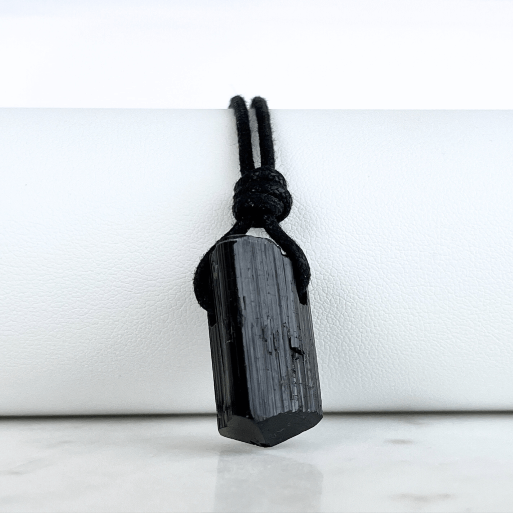 Raw Black Tourmaline Nugget Pendant - A symbol of rugged elegance and grounding by Luck Strings.