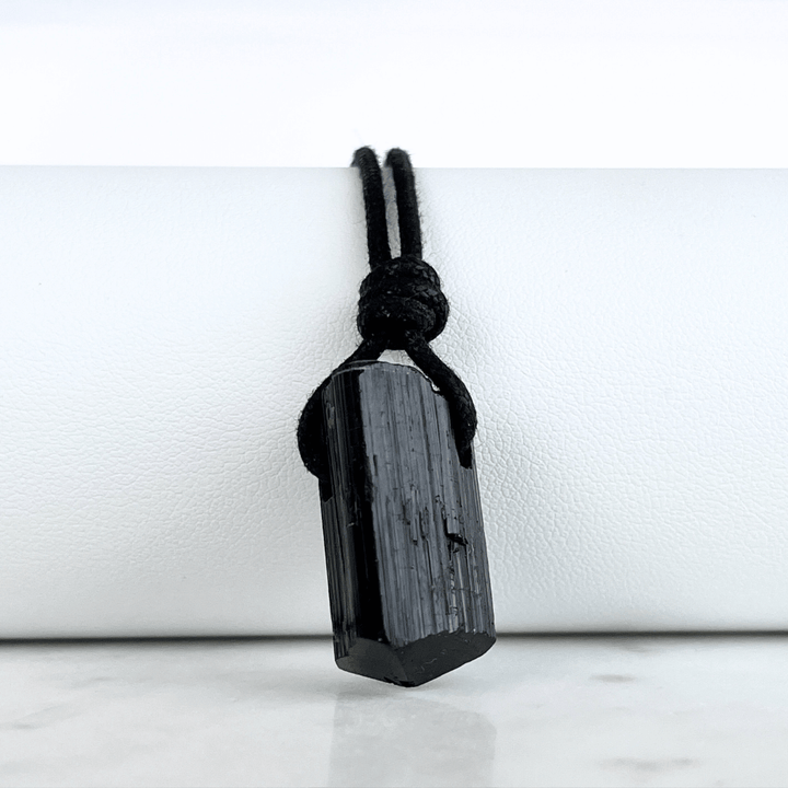Raw Black Tourmaline Nugget Pendant - A symbol of rugged elegance and grounding by Luck Strings.