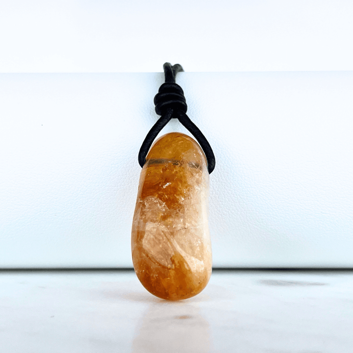 A handcrafted citrine nugget pendant, radiating elegance and charm.