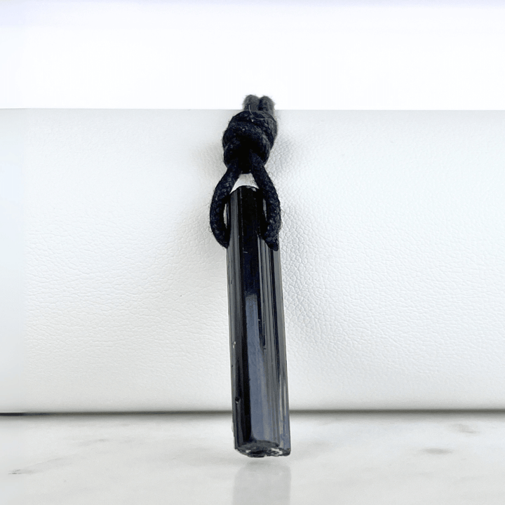 Raw Black Tourmaline Crystal Necklace - A symbol of grounding and transformation by Luck Strings.