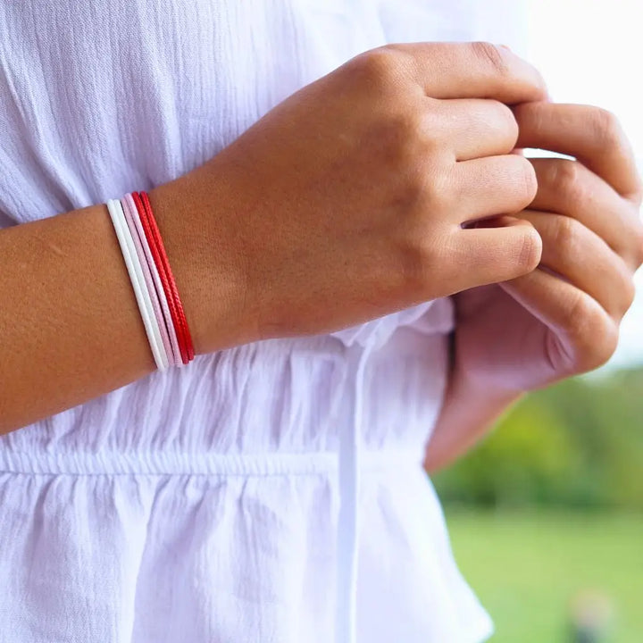 Modeled Red, Pink & White Cord Bracelet Set - Perfect for Vibrant Looks - Luck Strings