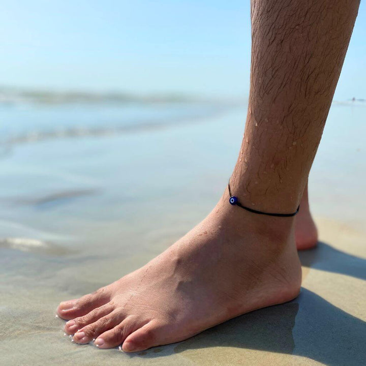 Adjustable evil eye anklet with durable cord and protective lucky eye charm, suitable for women, men, and teens. Perfect for beach - Luck Strings