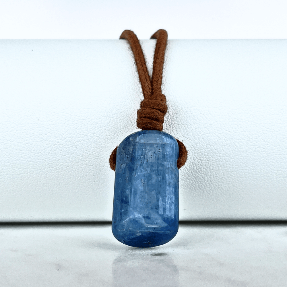 A unique handcrafted Kyanite pendant showcasing tranquil blue shades, embodying beauty and serenity.