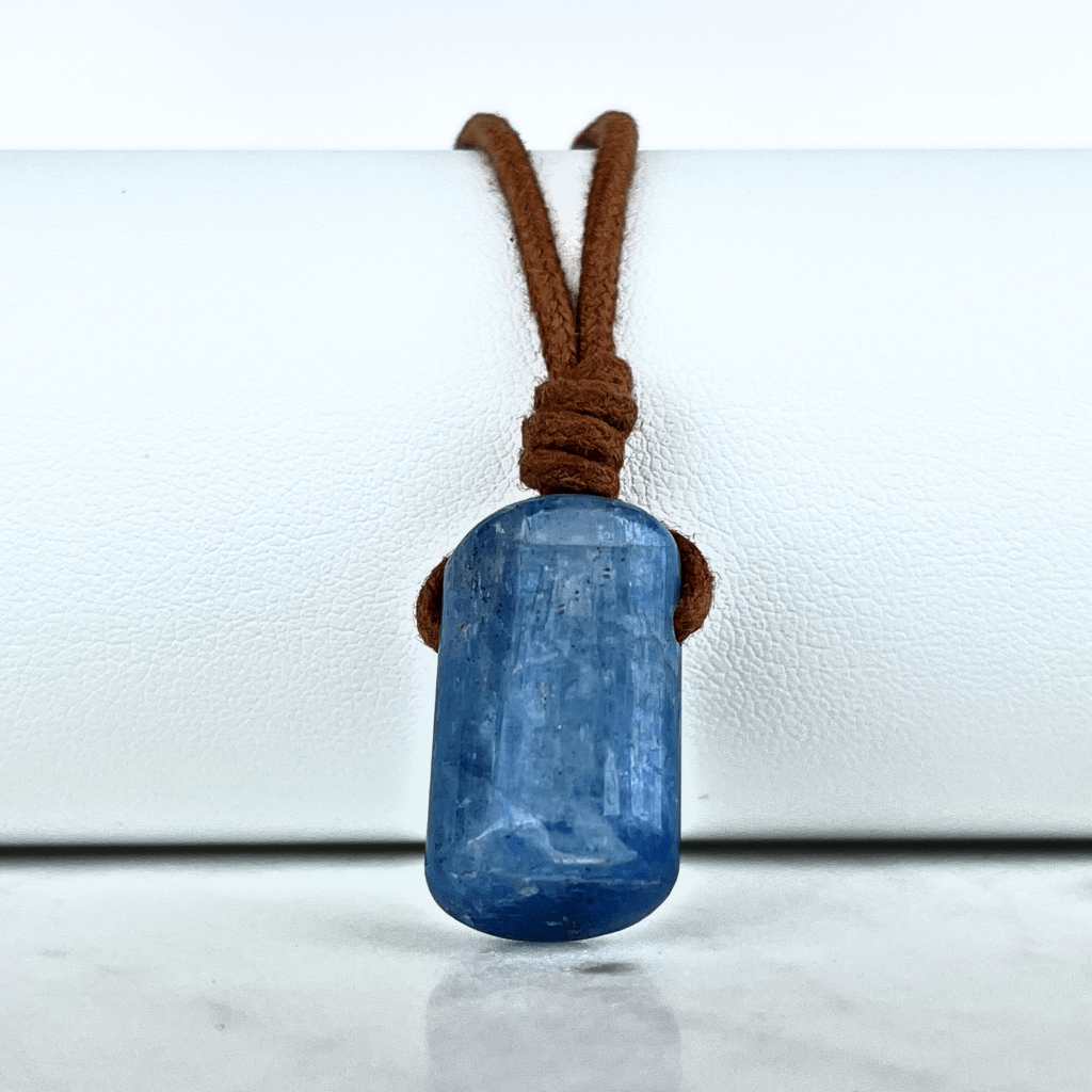 A unique handcrafted Kyanite pendant showcasing tranquil blue shades, embodying beauty and serenity.