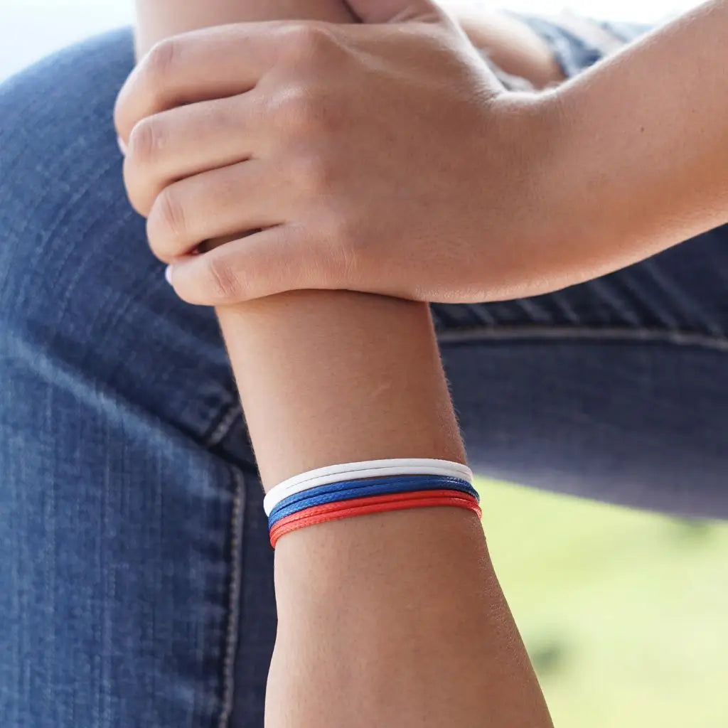 Modeled photo of Red-Navy-White Wax Nylon Cord Bracelets