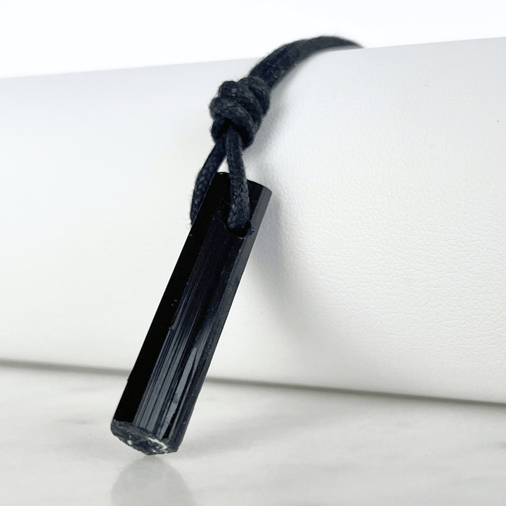 Raw Black Tourmaline Crystal Necklace - A symbol of grounding and transformation by Luck Strings.
