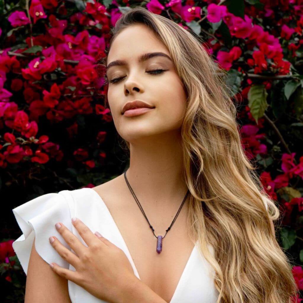 Woman elegantly wearing a Gemstone Bullet Point Necklace, showcasing its natural beauty and versatile charm - Luck Strings