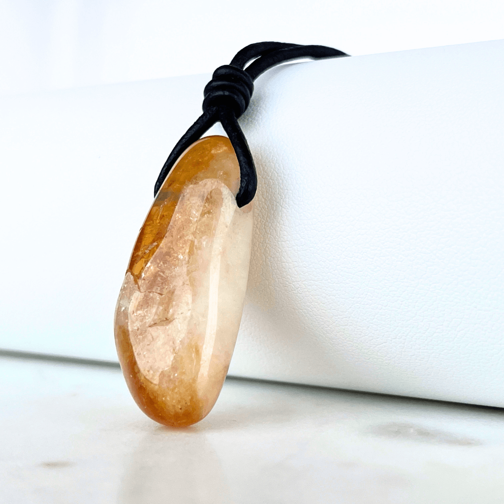 A handcrafted citrine nugget pendant, radiating elegance and charm.