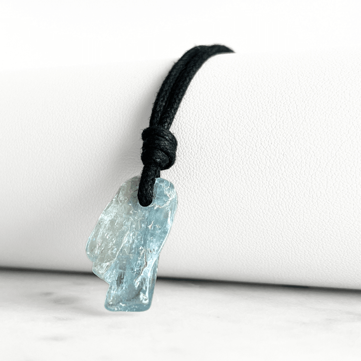 Tranquil Harmony: A pendant necklace adorned with a natural small aquamarine gemstone, representing the peaceful balance of tranquility and serenity.
