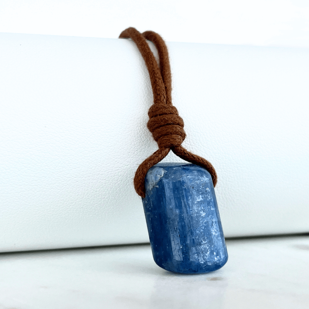 A unique handcrafted Kyanite pendant showcasing tranquil blue shades, embodying beauty and serenity.