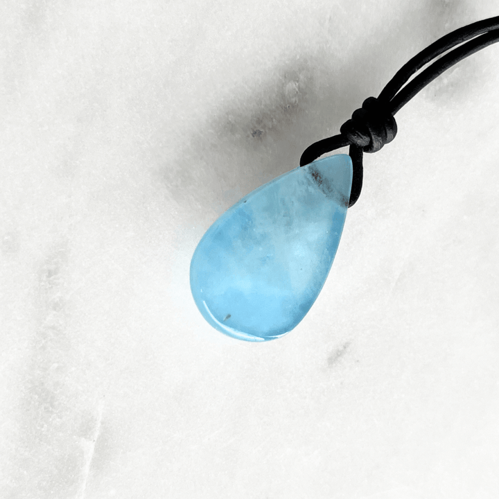 Serene Waters Aquamarine Teardrop Gemstone Pendant: A glistening aquamarine teardrop pendant, reminiscent of calm, tranquil waters.