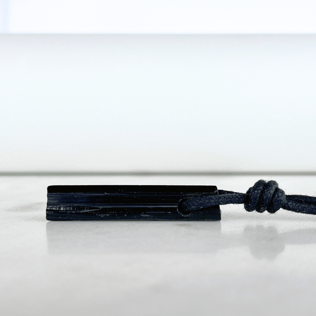 Raw Black Tourmaline Crystal Necklace - A symbol of grounding and transformation by Luck Strings.