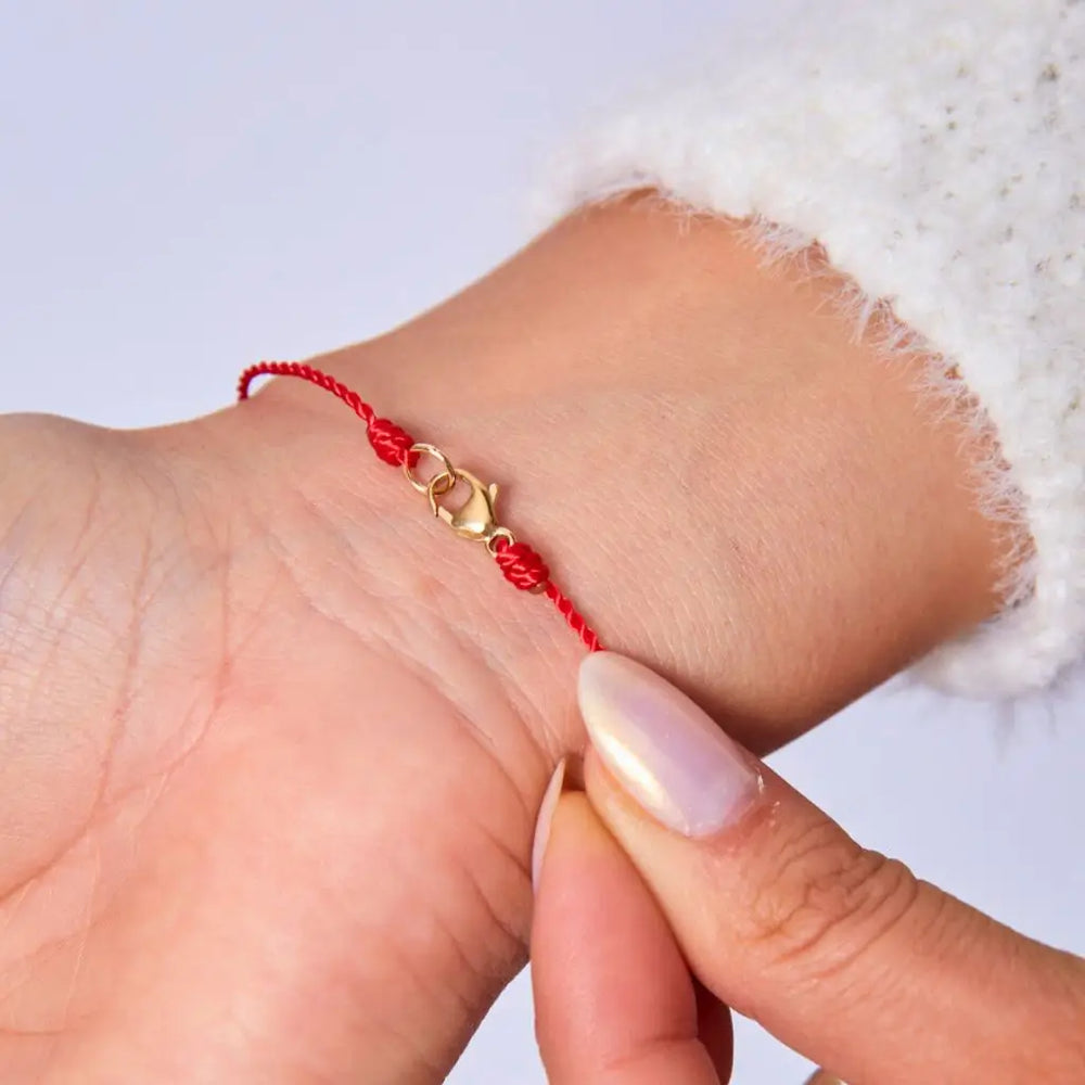 Silky Nylon Red String Bracelet in red and black on female wrist - Luck Strings