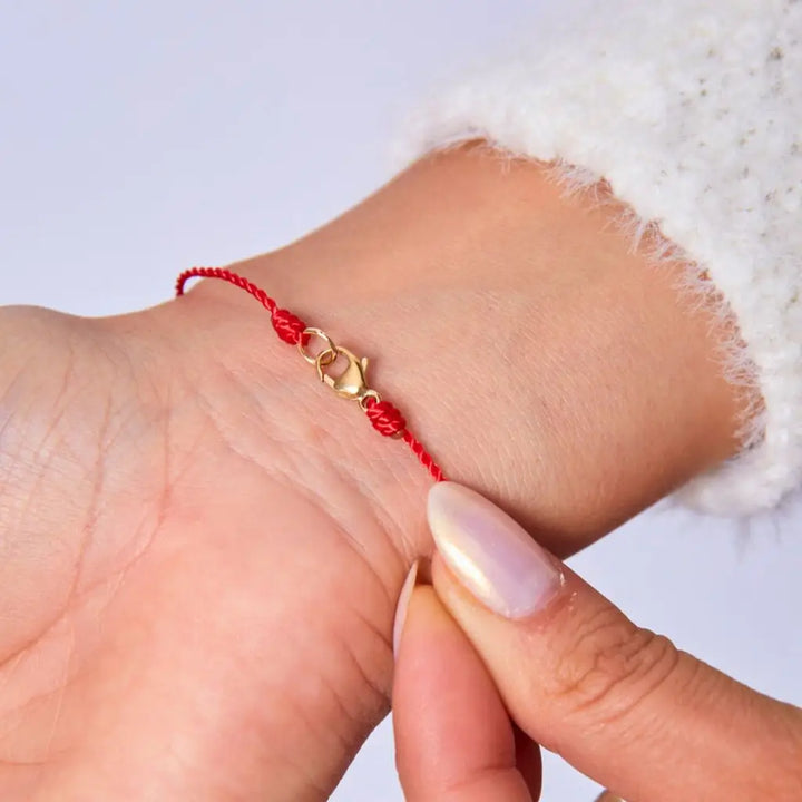 Silky Nylon Red String Bracelet in red and black on female wrist - Luck Strings