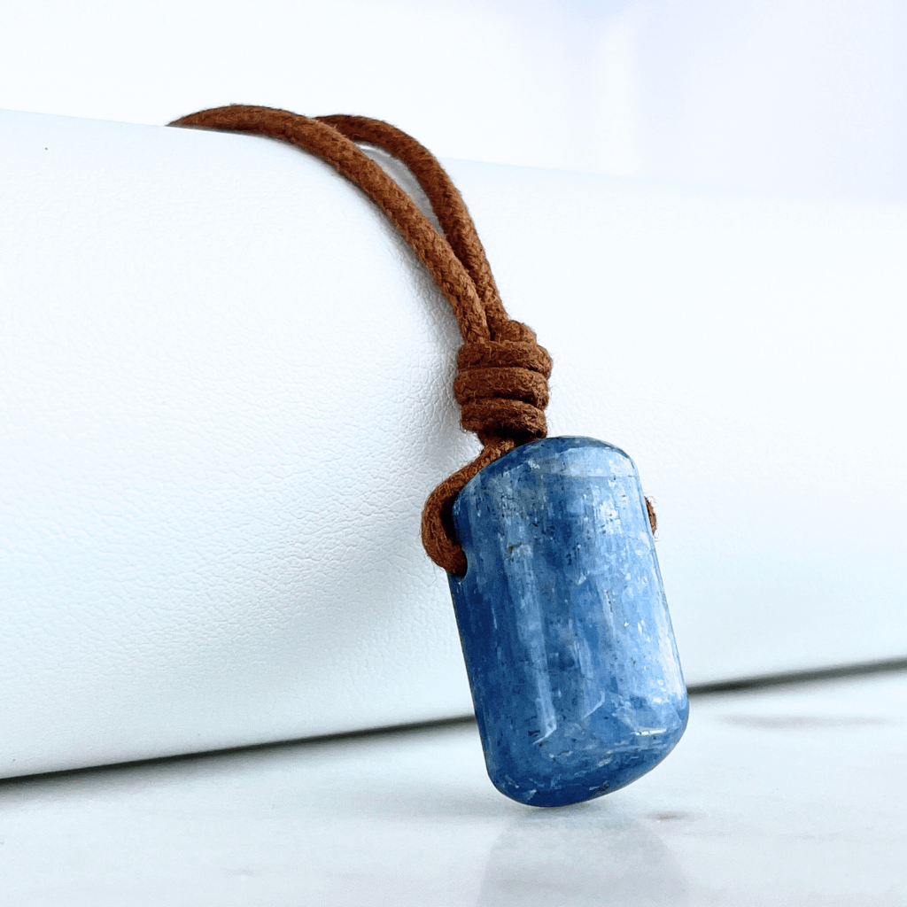 A unique handcrafted Kyanite pendant showcasing tranquil blue shades, embodying beauty and serenity.