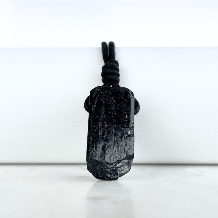 One-of-a-Kind Raw Black Tourmaline Pendant - A unique symbol of protection and individuality by Luck Strings.