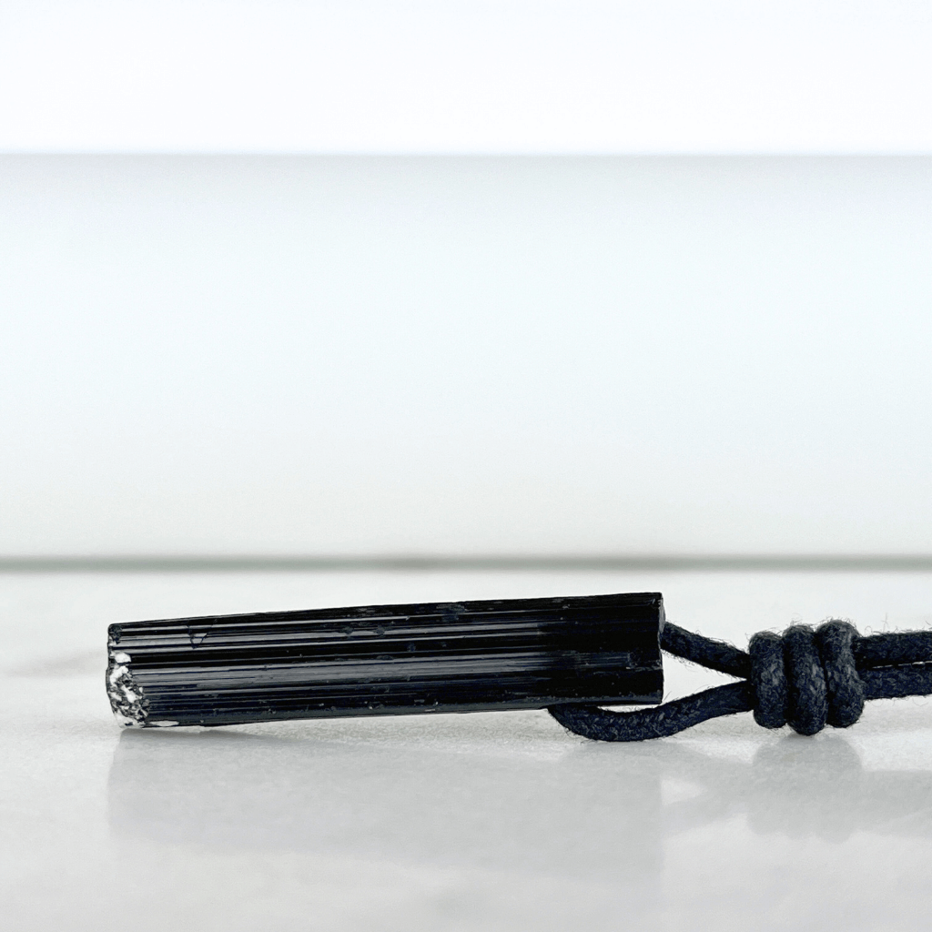 Raw Black Tourmaline Crystal Necklace - A symbol of grounding and transformation by Luck Strings.