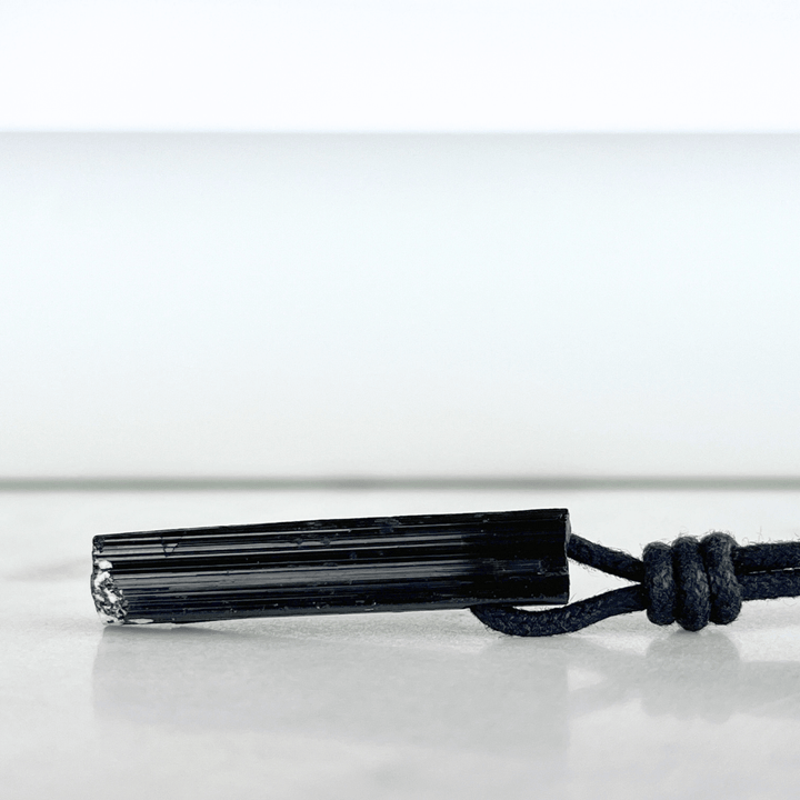 Raw Black Tourmaline Crystal Necklace - A symbol of grounding and transformation by Luck Strings.