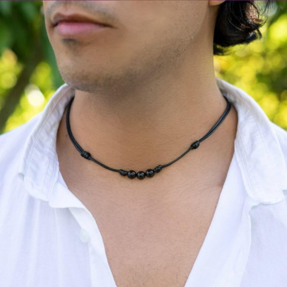 Man adorned with a Black Tourmaline Beaded Choker, highlighting how the dark, protective beads complement his modern and stylish look - Luck Strings