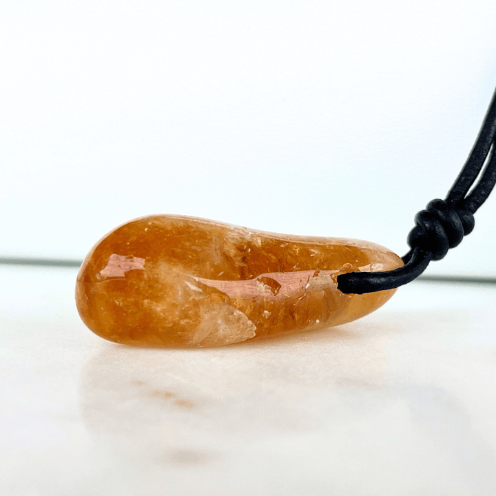 A handcrafted citrine nugget pendant, radiating elegance and charm.