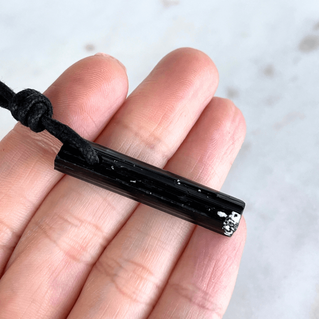 Raw Black Tourmaline Crystal Necklace - A symbol of grounding and transformation by Luck Strings.