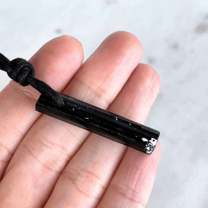 Raw Black Tourmaline Crystal Necklace - A symbol of grounding and transformation by Luck Strings.