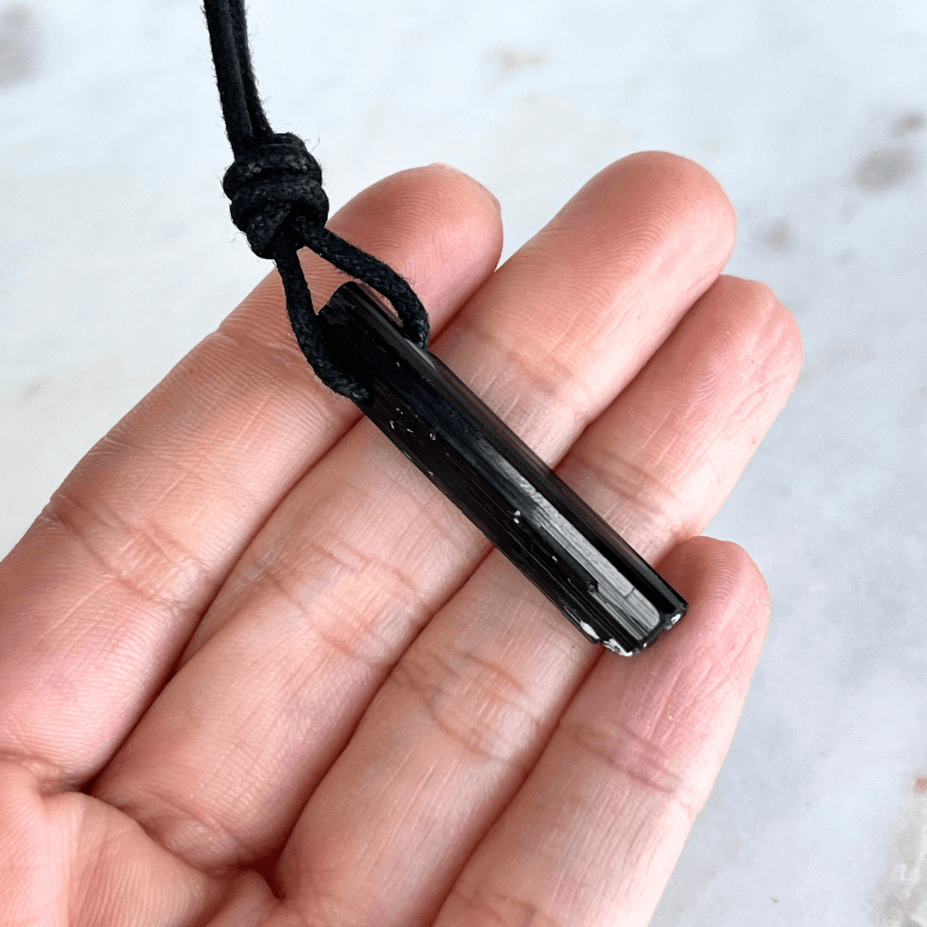 Raw Black Tourmaline Crystal Necklace - A symbol of grounding and transformation by Luck Strings.