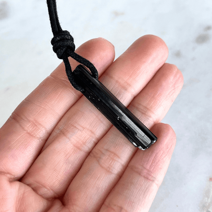 Raw Black Tourmaline Crystal Necklace - A symbol of grounding and transformation by Luck Strings.
