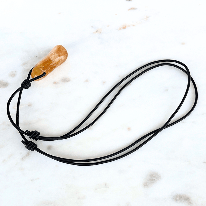A handcrafted citrine nugget pendant, radiating elegance and charm.