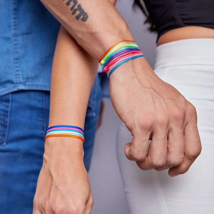 couple-wearing-luck-strings-multicolor-nylon-adjustable-bracelets-on-wrist