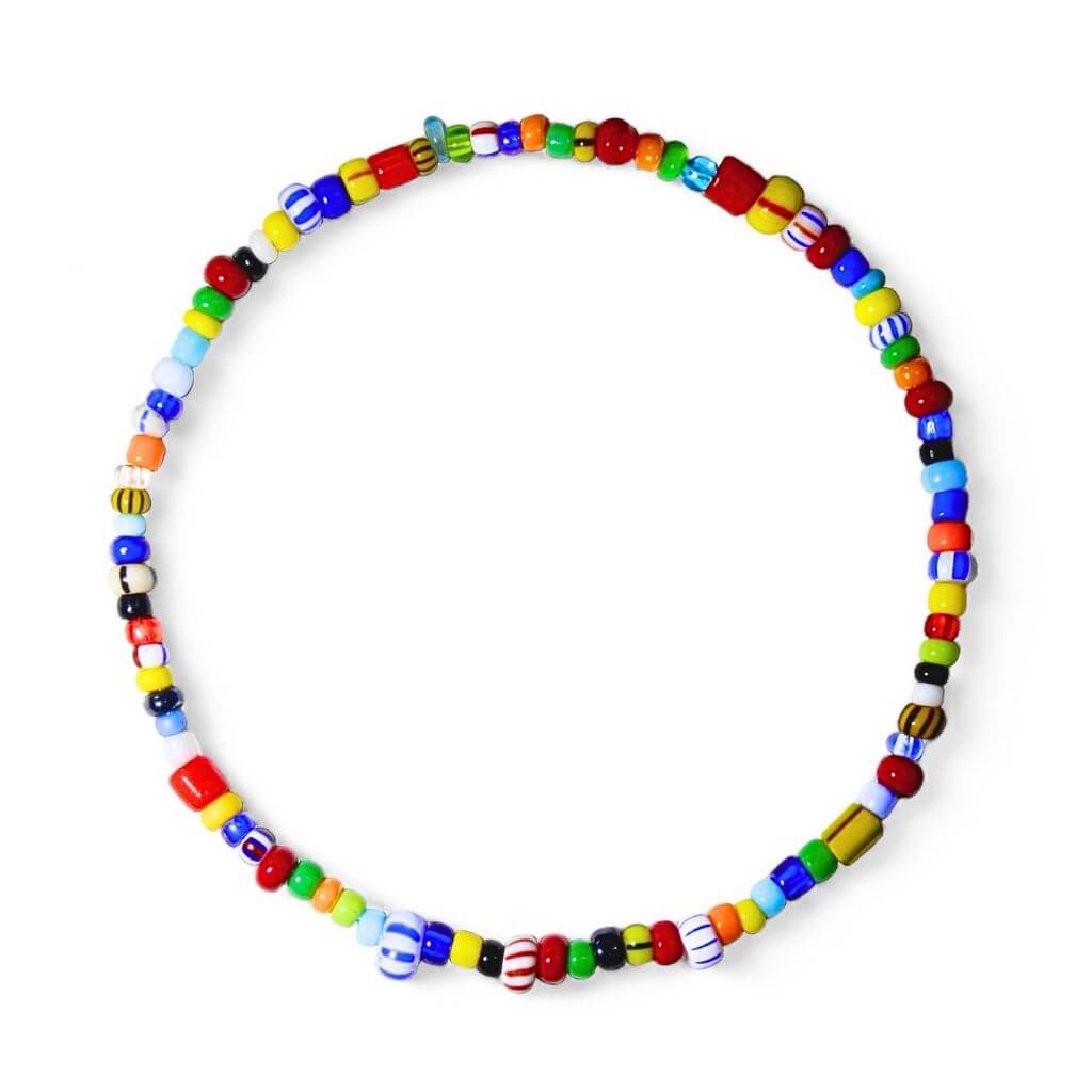 A colorful vintage tiny beaded bracelet with a variety of colored beads on a stretch cord.