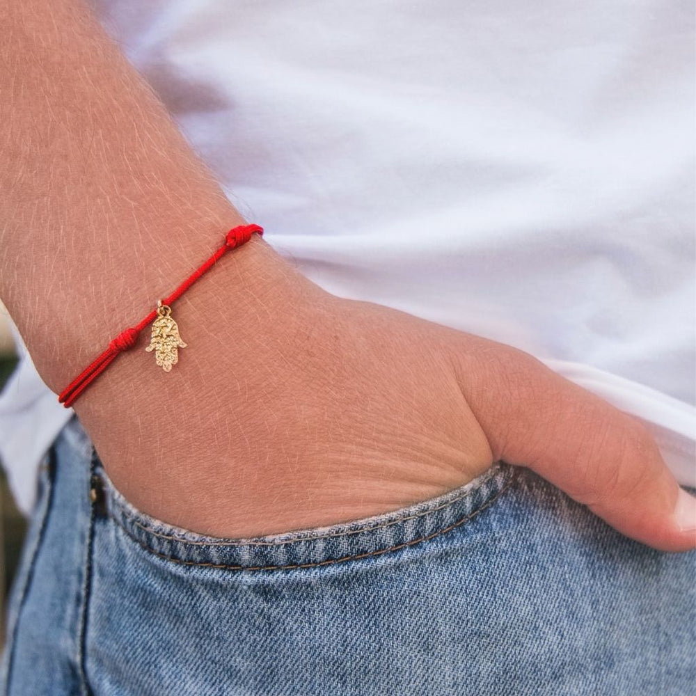 Adjustable gold vermeil Hamsa bracelet symbolizing protection and luck. Luck Strings