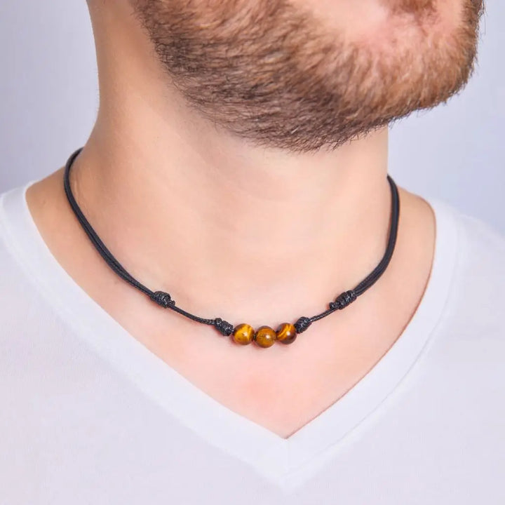 Men showcasing a Tiger Eye Choker, with the stone's distinctive golden-brown shimmer accentuating their stylish and confident look - Luck Strings