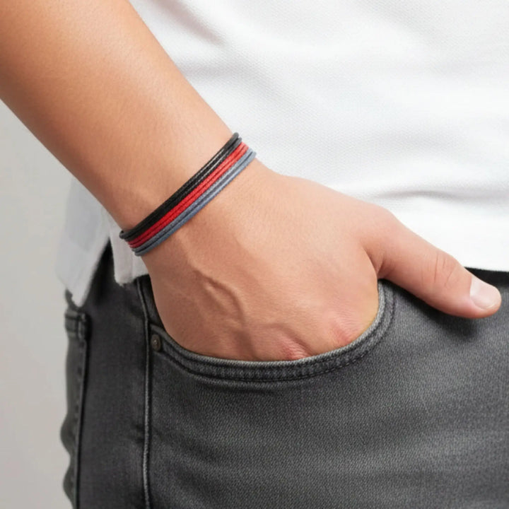 Person wearing a bracelet with a neutral background