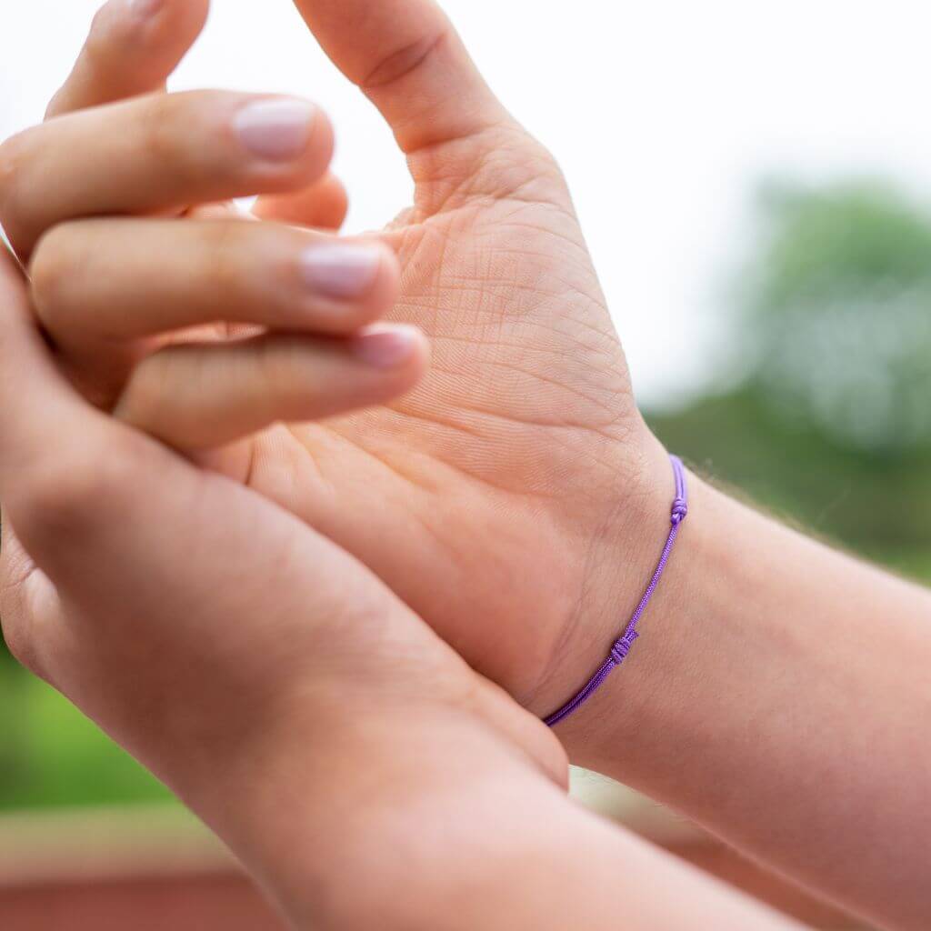 men wearing a ajustable cord bracelets