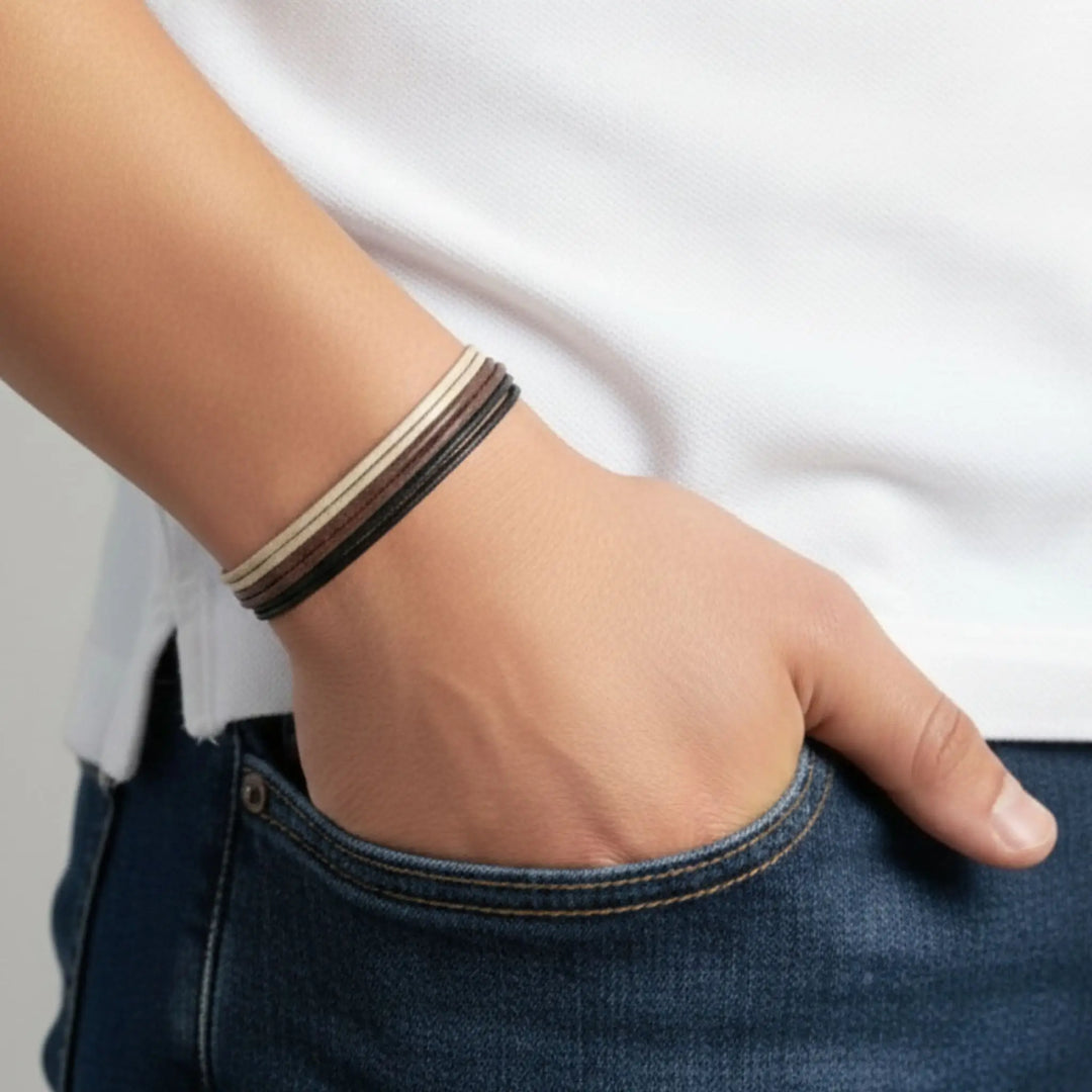 Hand with a bracelet on a plain background