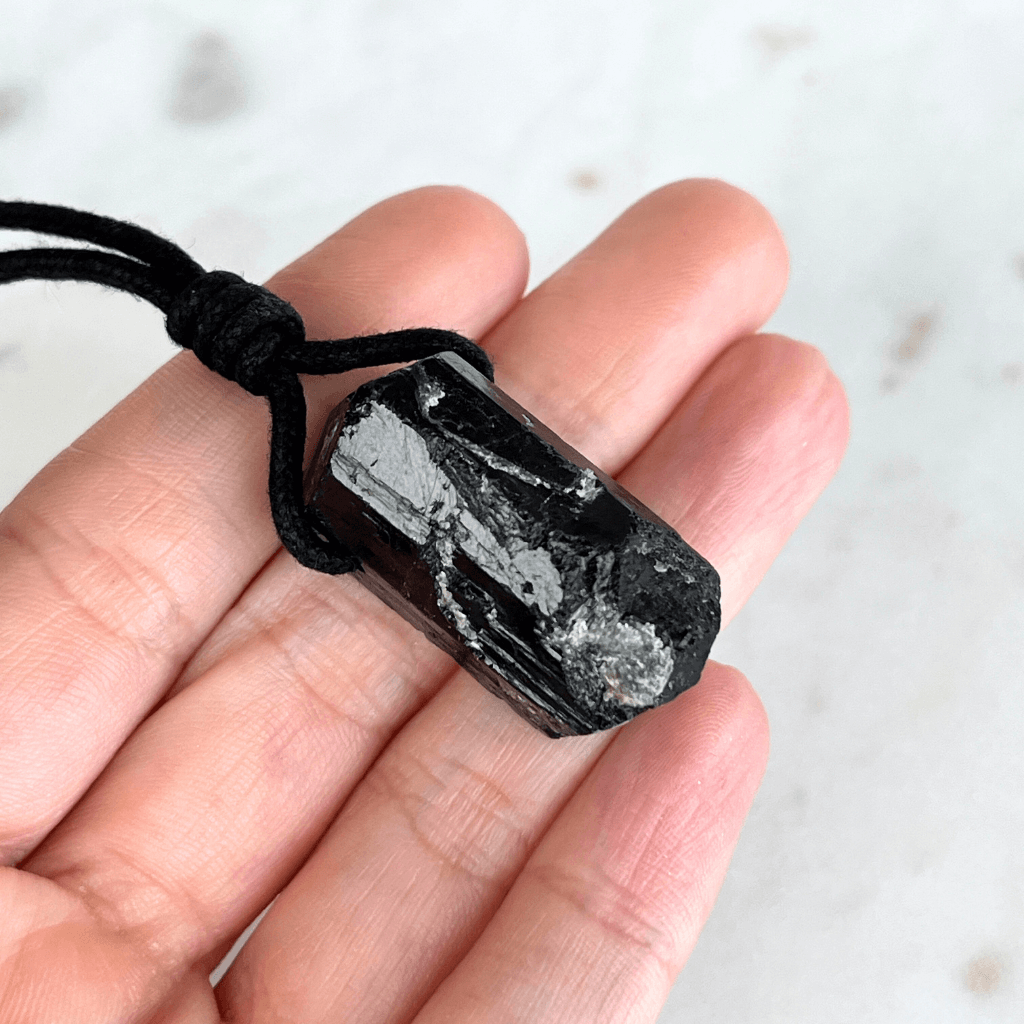 One-of-a-Kind Raw Black Tourmaline Pendant - A unique symbol of protection and individuality by Luck Strings.
