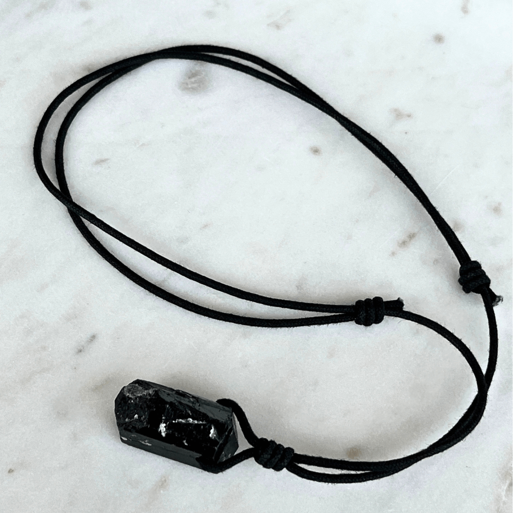 One-of-a-Kind Raw Black Tourmaline Pendant - A unique symbol of protection and individuality by Luck Strings.