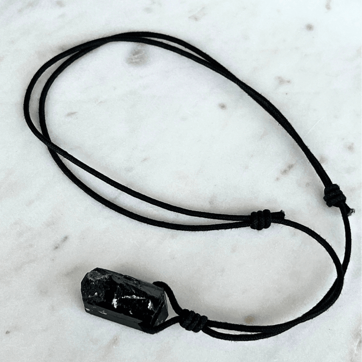 One-of-a-Kind Raw Black Tourmaline Pendant - A unique symbol of protection and individuality by Luck Strings.