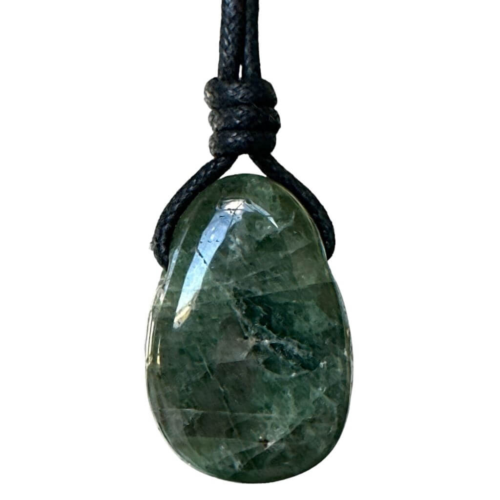 A diopside gemstone pendant attached to a water-friendly, boho wax cotton cord for an adjustable necklace.