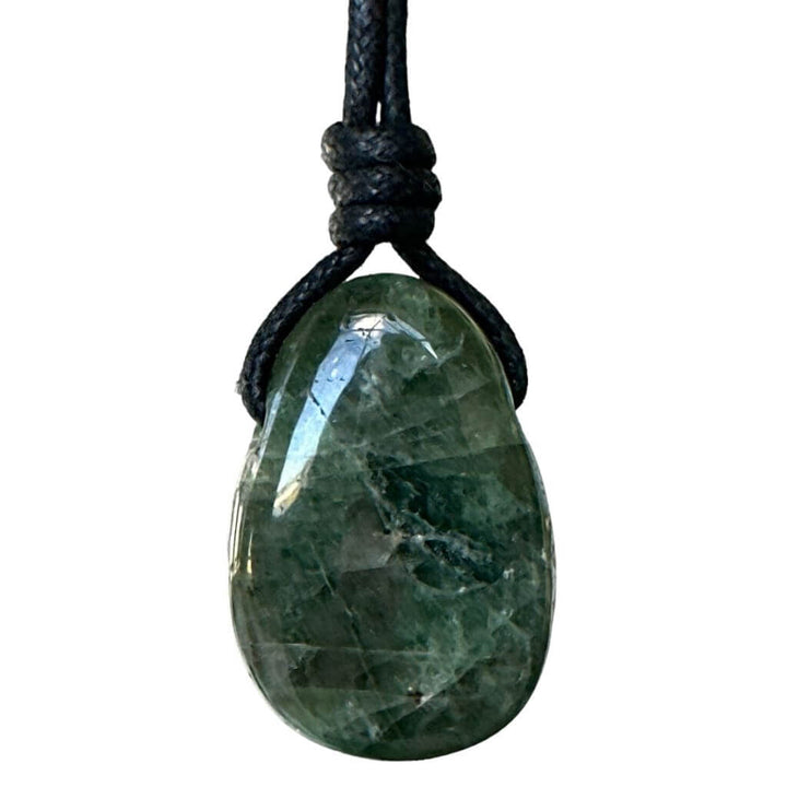 A diopside gemstone pendant attached to a water-friendly, boho wax cotton cord for an adjustable necklace.