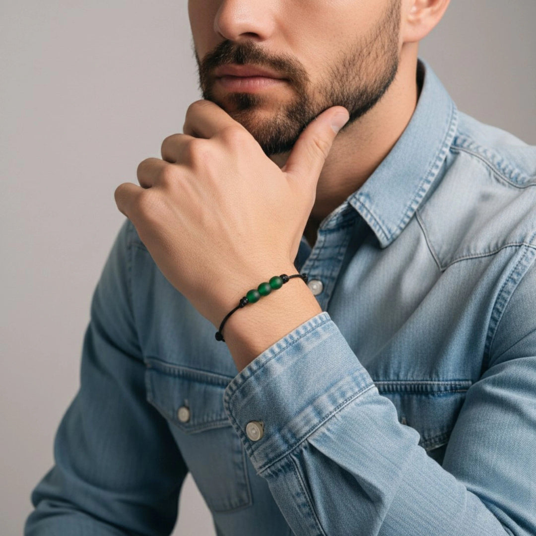 Man wearing a denim shirt with a blurred background