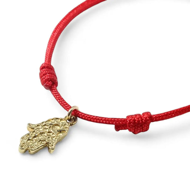 Adjustable gold vermeil Hamsa bracelet symbolizing protection and luck. Luck Strings